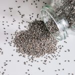 black beads in clear glass jar